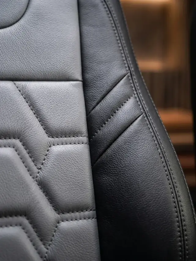 Macro de costura y textura de cuero automotriz